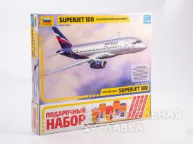 Региональный пассажирский авиалайнер Superjet 100 с клеем, кисточкой и красками.